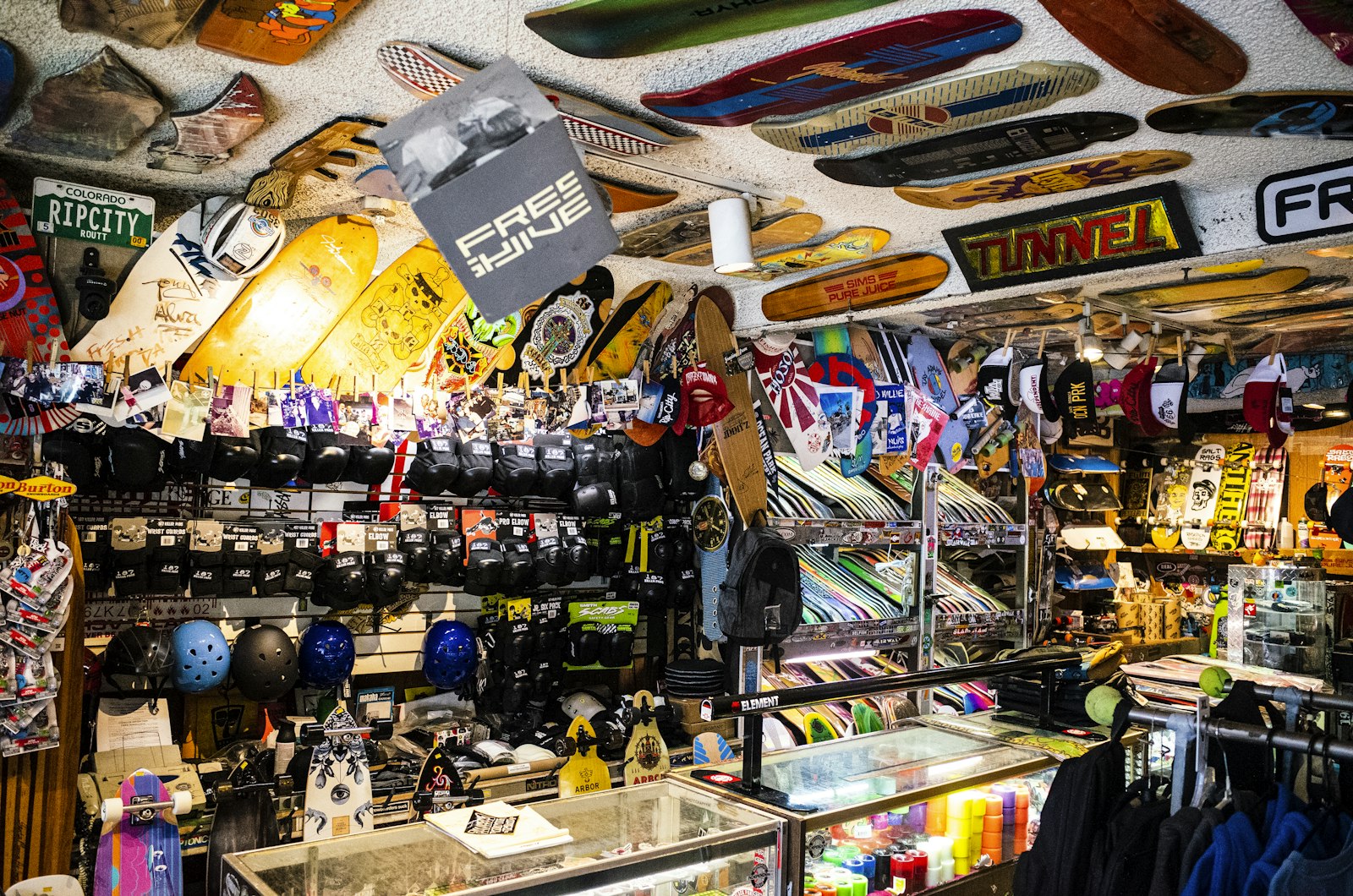 Rack of skateboard decks lining the wall of Joneboro Skate Shop